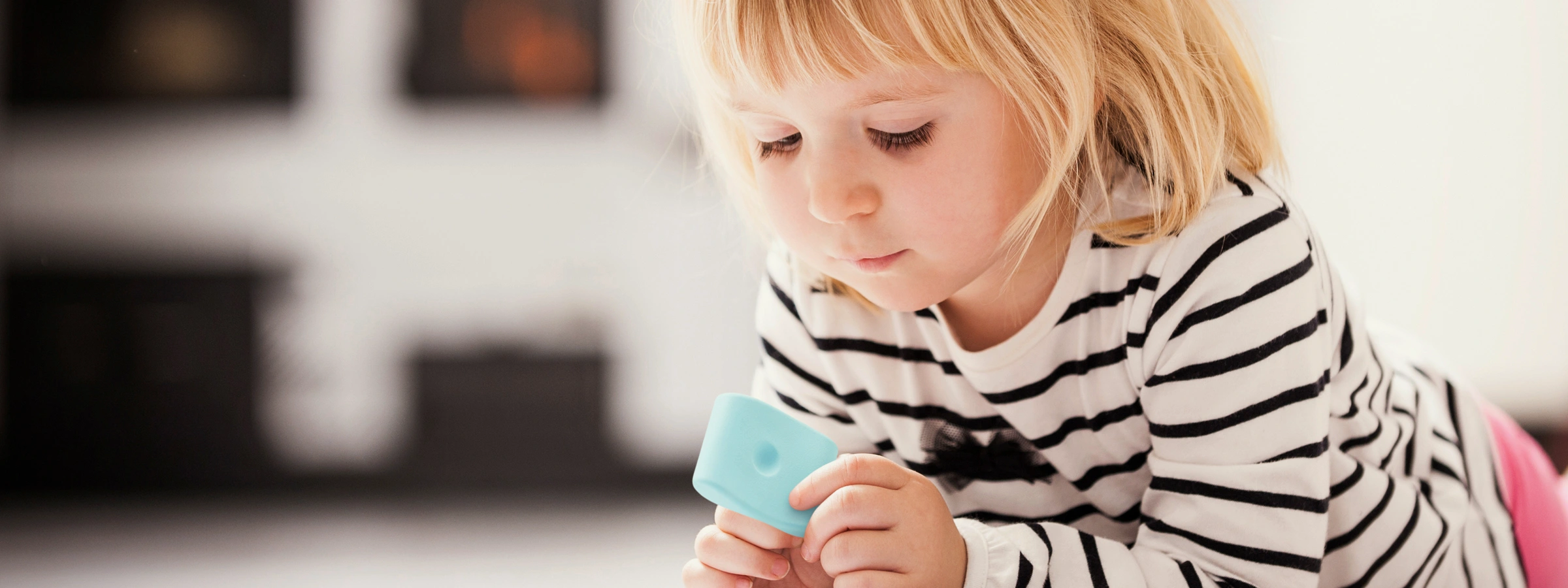 Child concentrating and learning through hands-on play