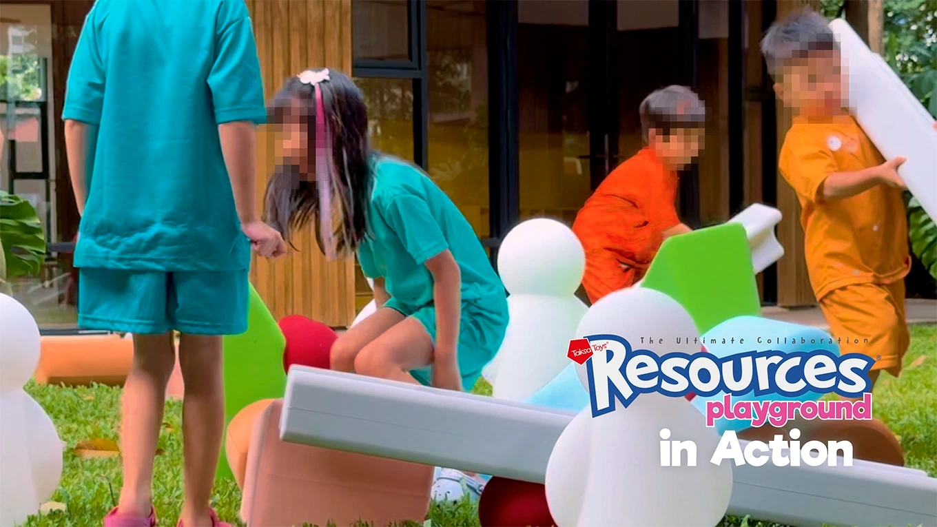 Children building and moving large-scale structures together with Resources® Playground, exploring balance and coordination through collaborative play.