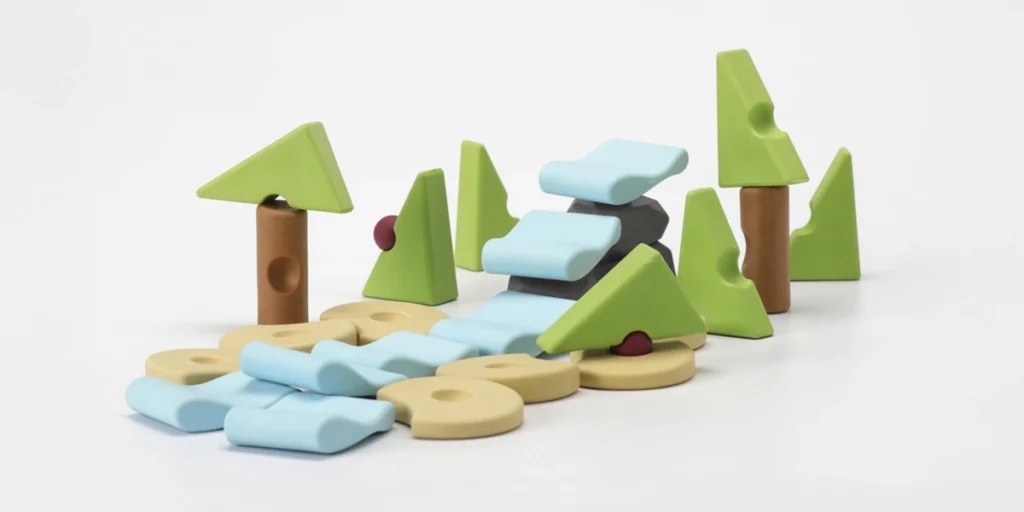 Resources® open-ended construction toy arranged as a forest landscape with a stream and waterfall